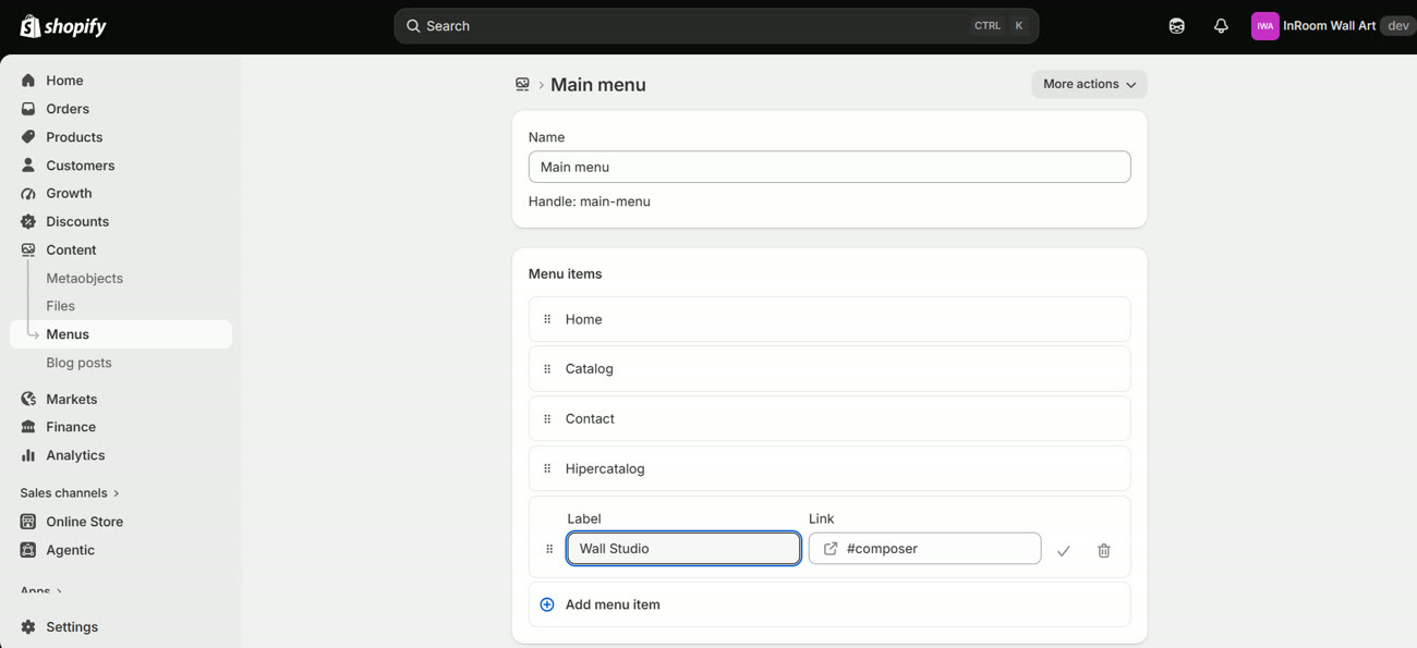 The main-menu editor with a Wall Studio item whose link is #composer
